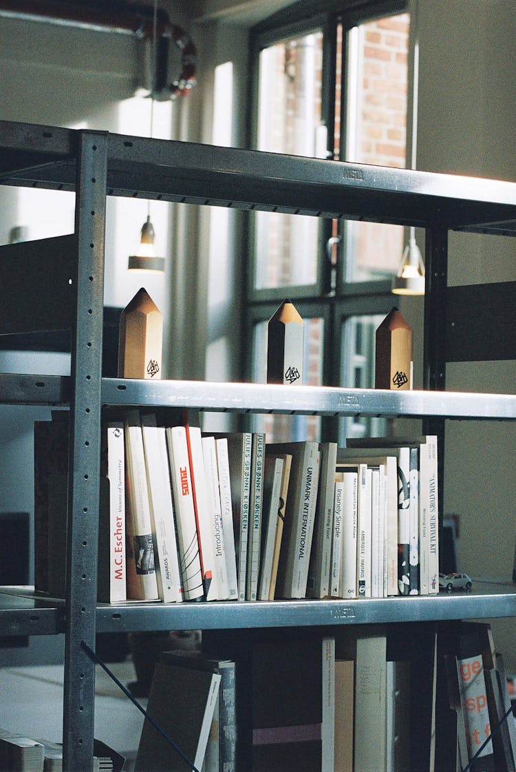 Office shelves with books and some awards